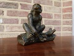 Signed with a V.1902 style Miniature bronze sculpture of a monkey in patinated bronze 1900