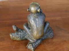 Signed with a V.1902 style Miniature bronze sculpture of a monkey in patinated bronze 1900