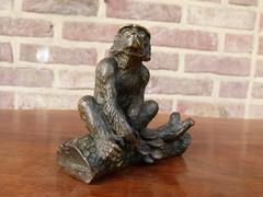 Signed with a V.1902 style Miniature bronze sculpture of a monkey in patinated bronze 1900