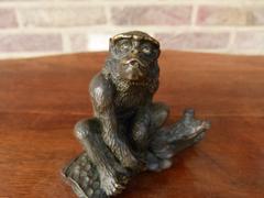 Signed with a V.1902 style Miniature bronze sculpture of a monkey in patinated bronze 1900