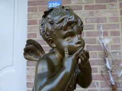 style Sulpture by Auguste Moreau of a winged putto giving hand kisses in patinated bronze, France 1880